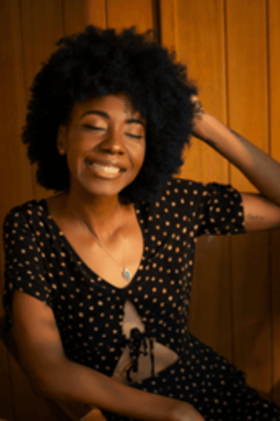 Bare Skynn Naturals Hero Image Bare Skynn Naturals Hero Image showing a dark skinned girl smilling with beautiful afro hair